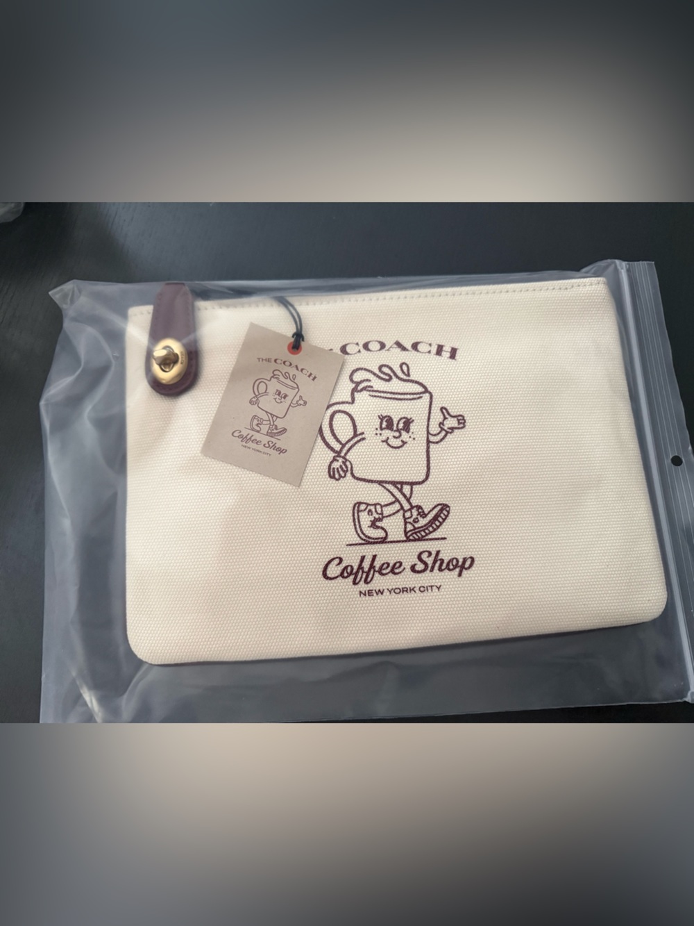 COACH Cream Canvas 'Coffee Shop' Graphic Pouch with Brown Leather Strap